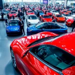 Explore the vibrant atmosphere of the Auto Cars Show with sleek vehicles and enthusiastic attendees.