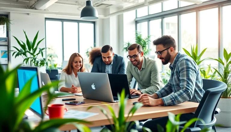 Engaged digital marketing professionals using laptops at https://www.pnmmedia.com in a modern workspace.