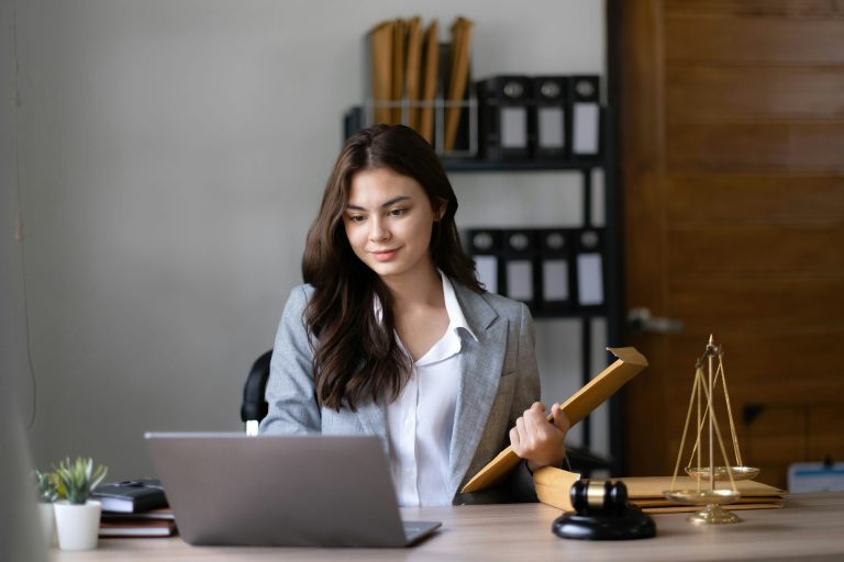 asian-lawyer-woman-working-with-a-laptop-computer-in-a-law-office-legal-and-legal-service-concept-